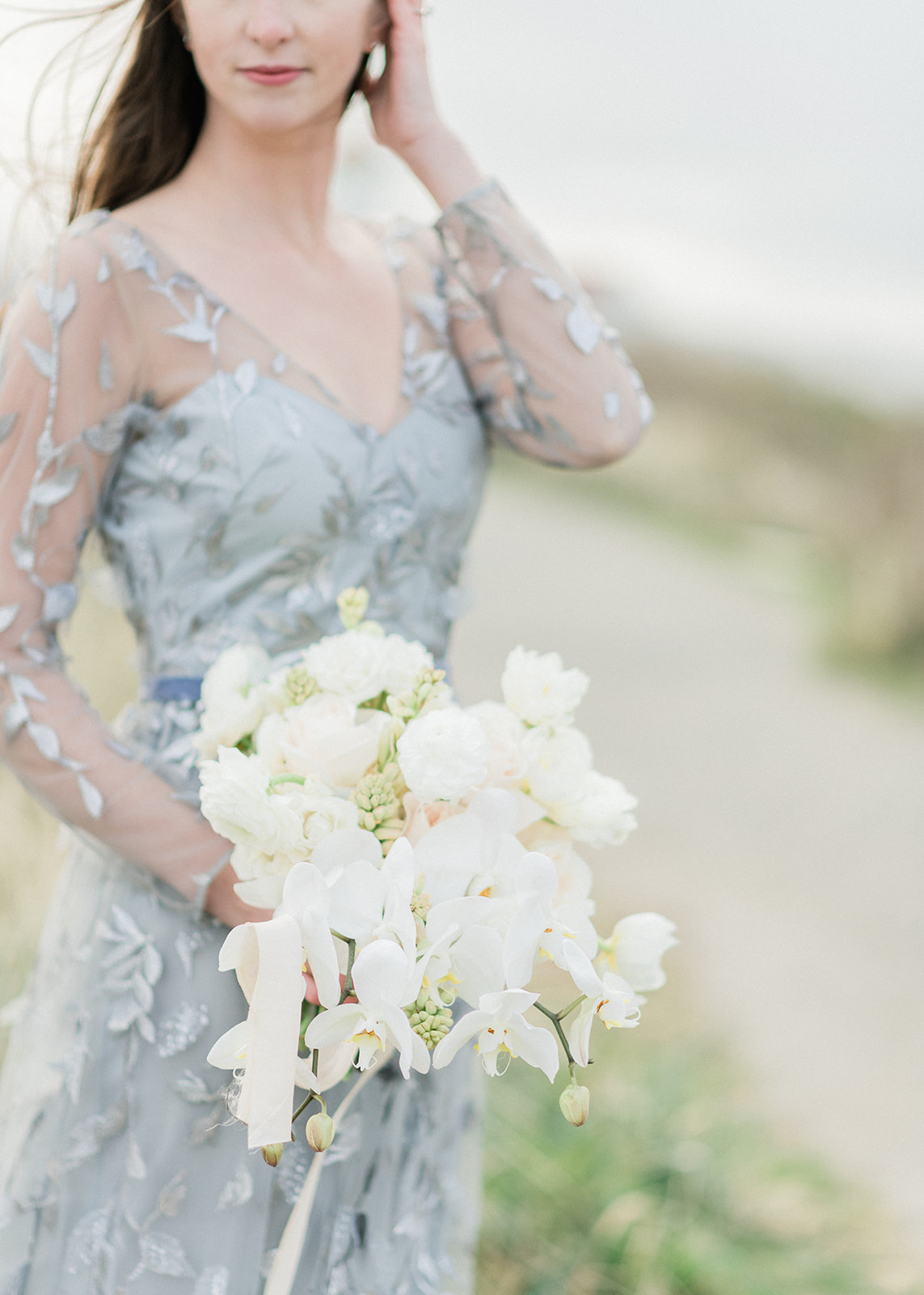 Bride standing with bouquet