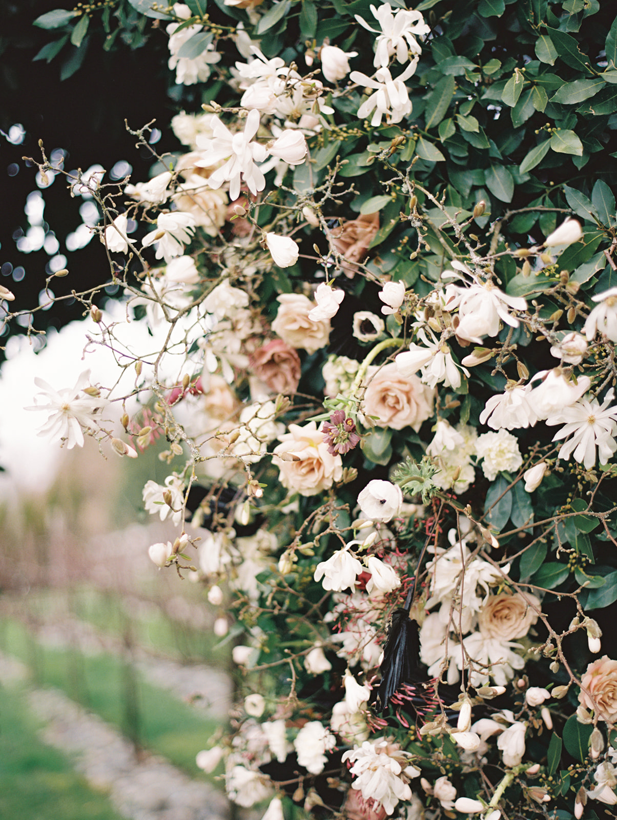 A floral hedge installation at Chateau Lill wedding ceremony outdoors