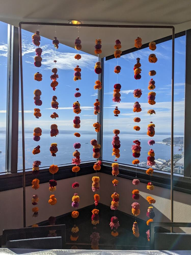 a floral installation with flower strands in the columbia tower club