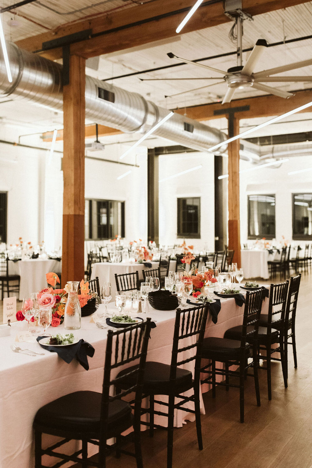 Block 41's indoor wedding space, with industrial touches, large wooden beams, and exposed ductwork