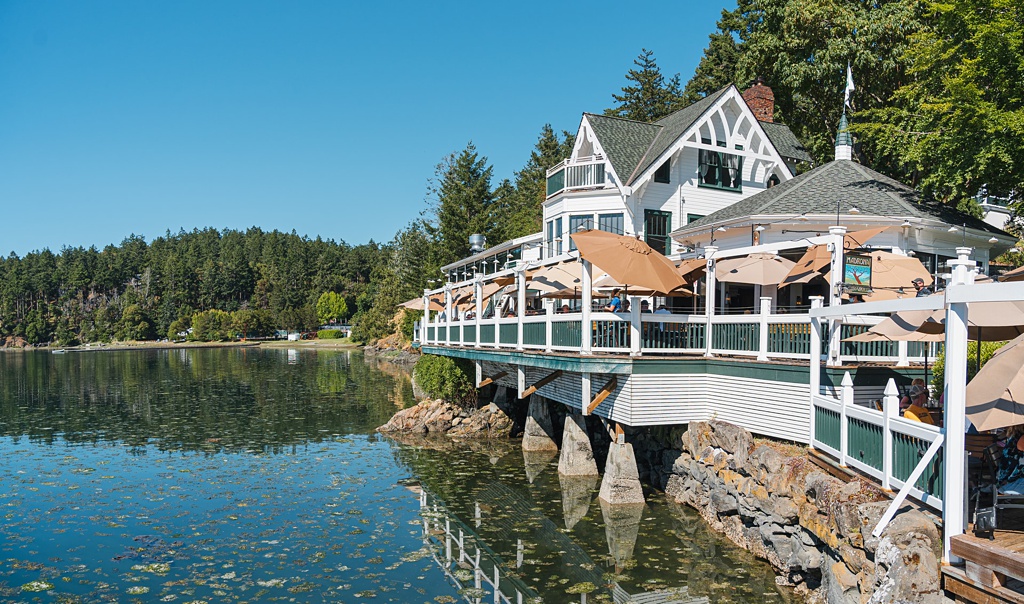 An image of Roche Harbor Resort perched on the edge of the water