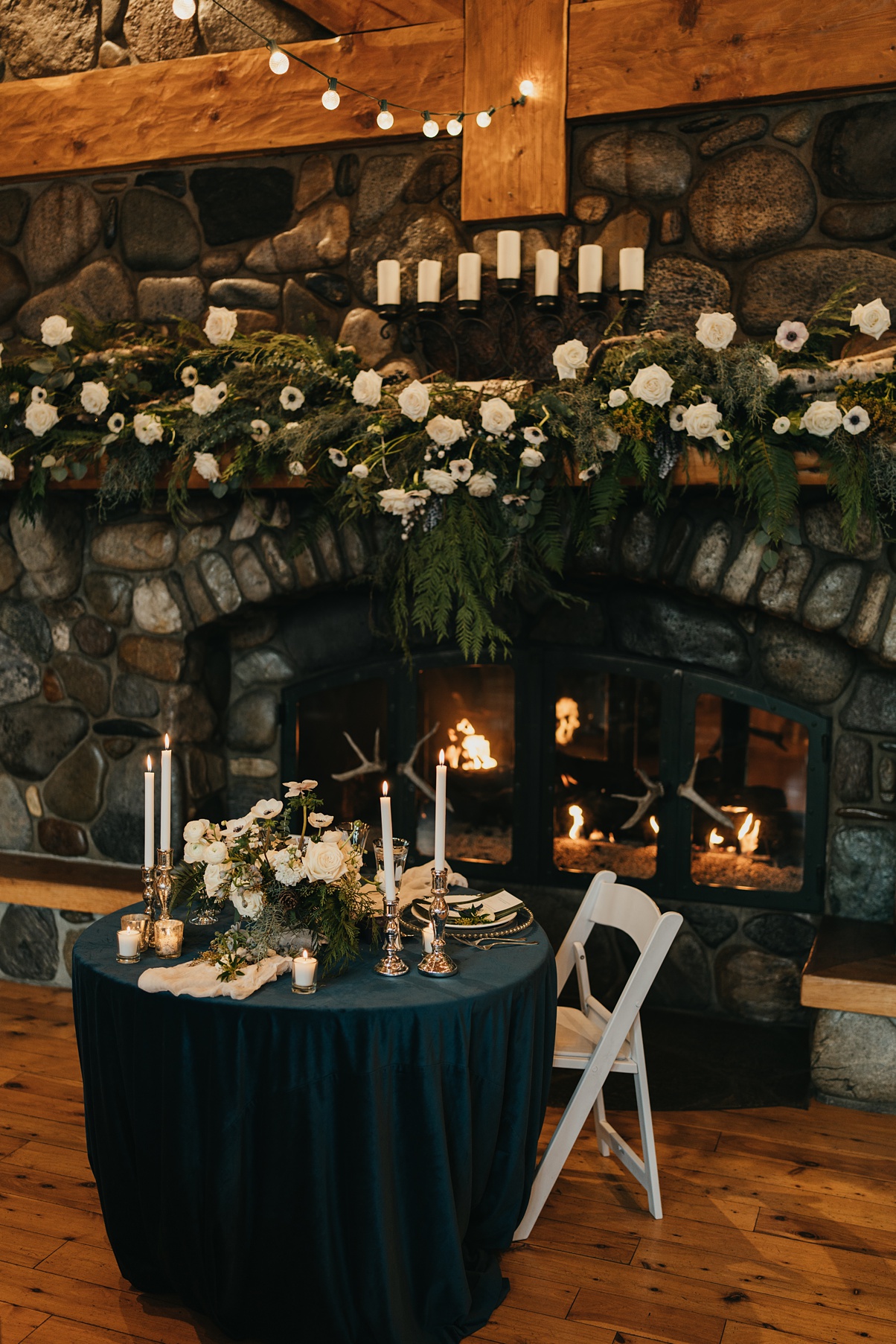 The sweetheart table and mantle floral installation