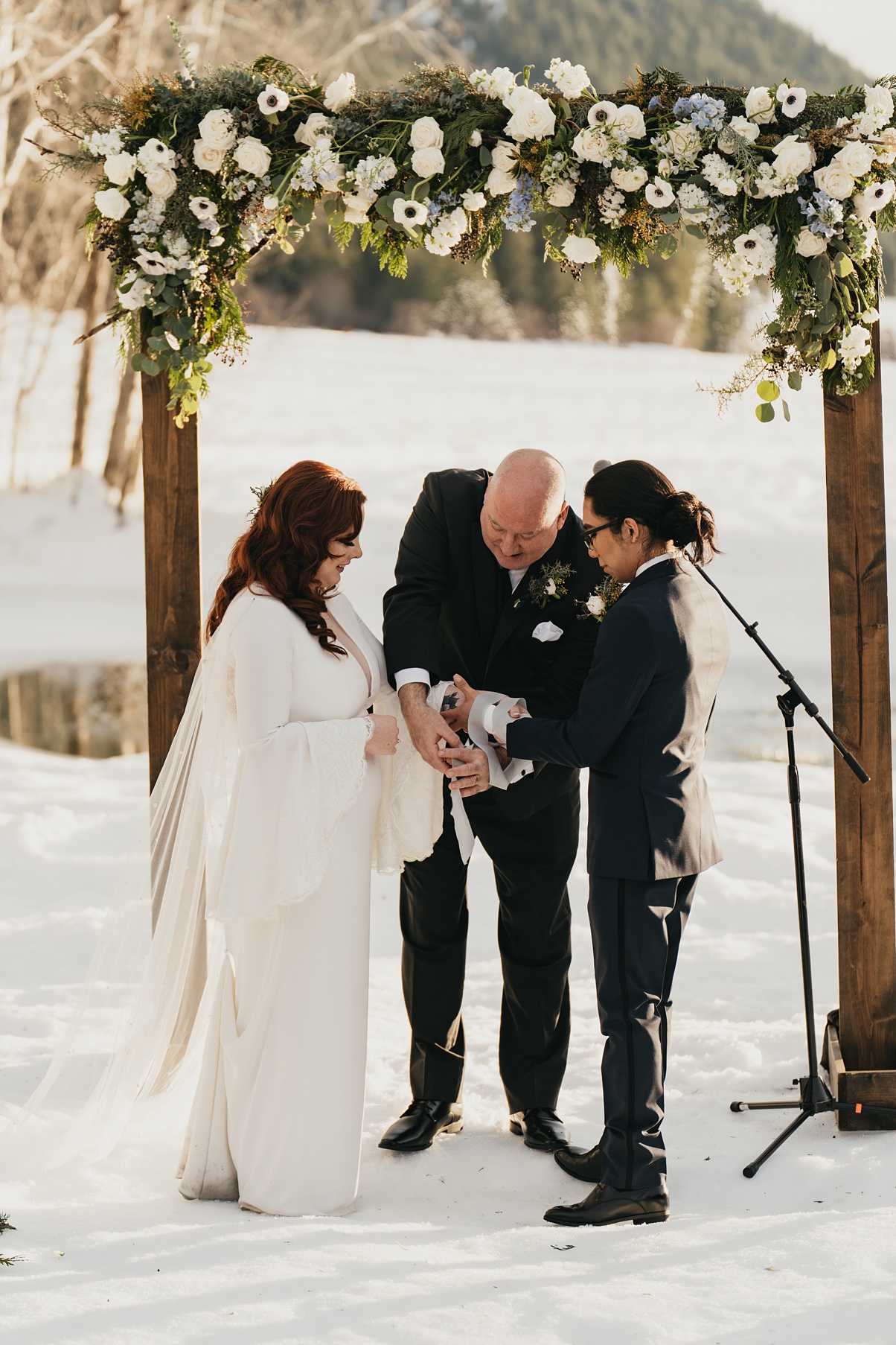 A couple completing their handfasting wedding ceremony at Mountain Springs Lodge