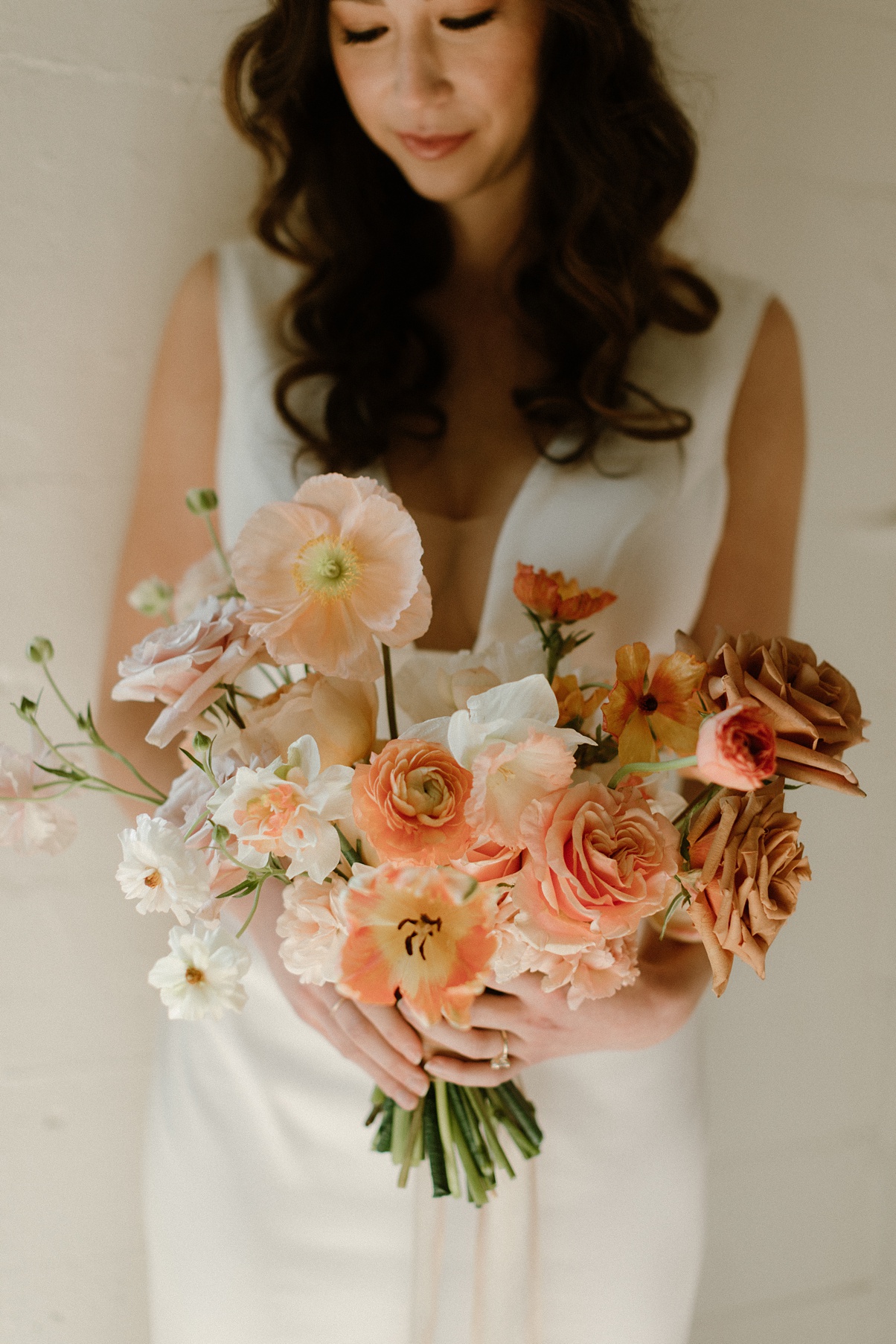 Block 41 wedding bridal bouquet in sophisticated color palette of taupes, blushes, and orange