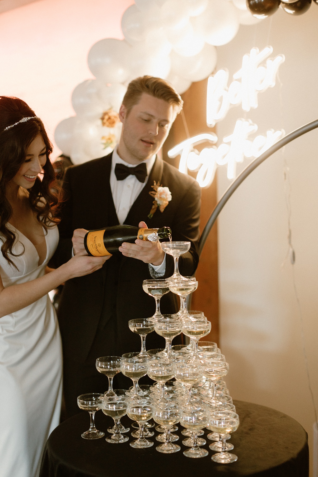 Block 41 wedding champage tower with couple pouring champagne