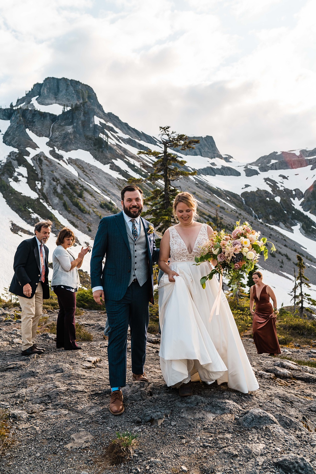 The couple exits their mountaintop ceremony for that just married look!
