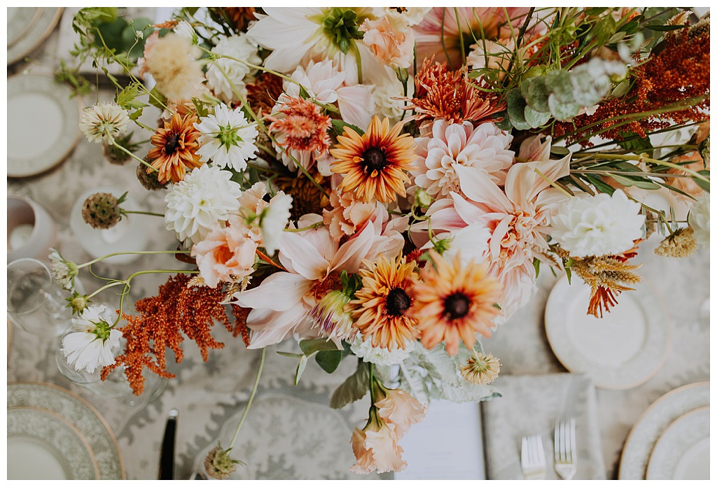an aerial view of a boho floral centerpiece for this fall wedding