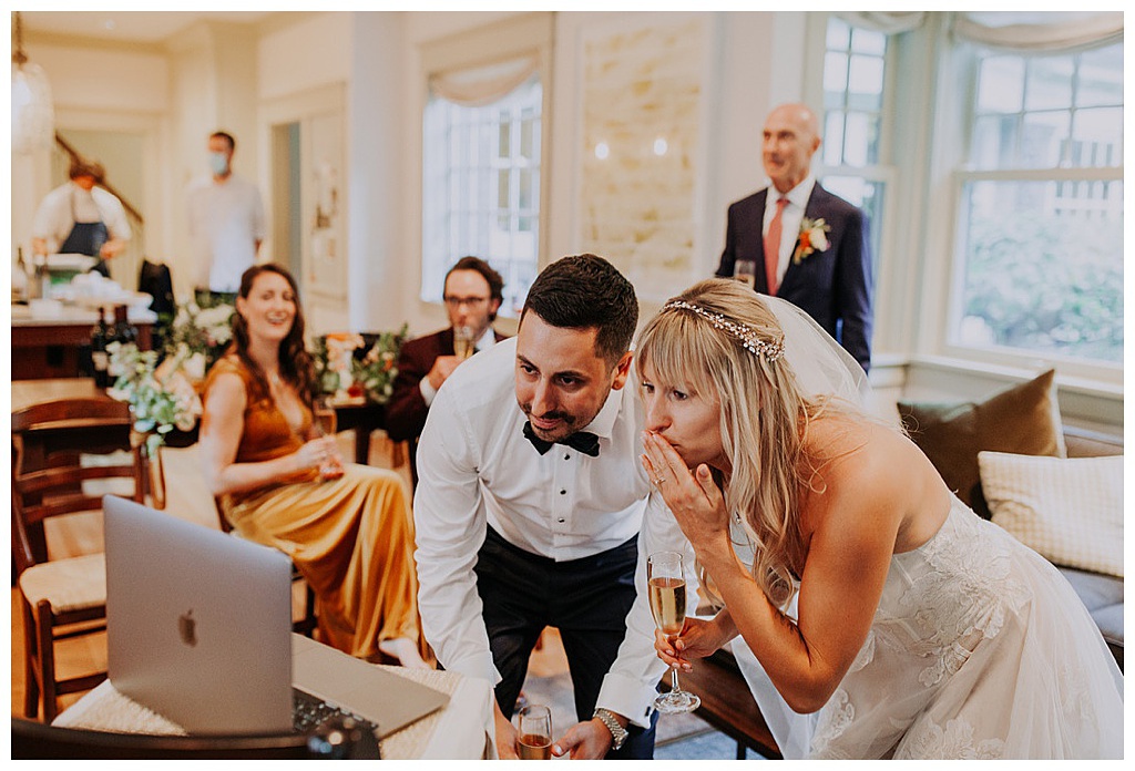 The couples blow kisses to their wedding attendees via zoom