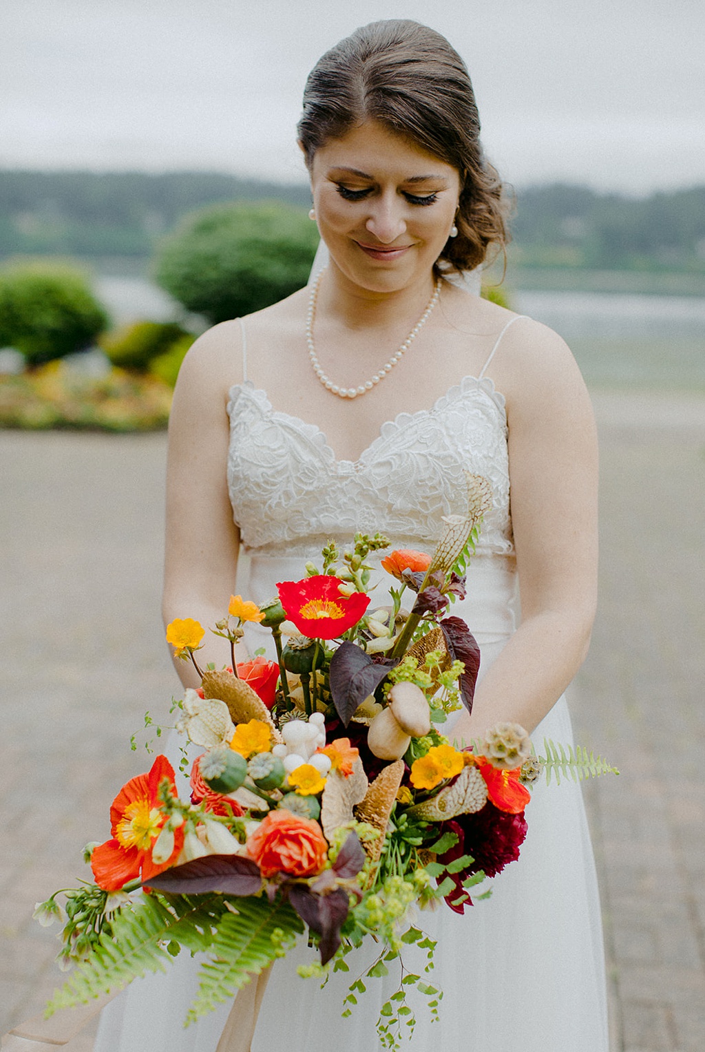 A bride holding her wedding bouquet at Kiana Lodge