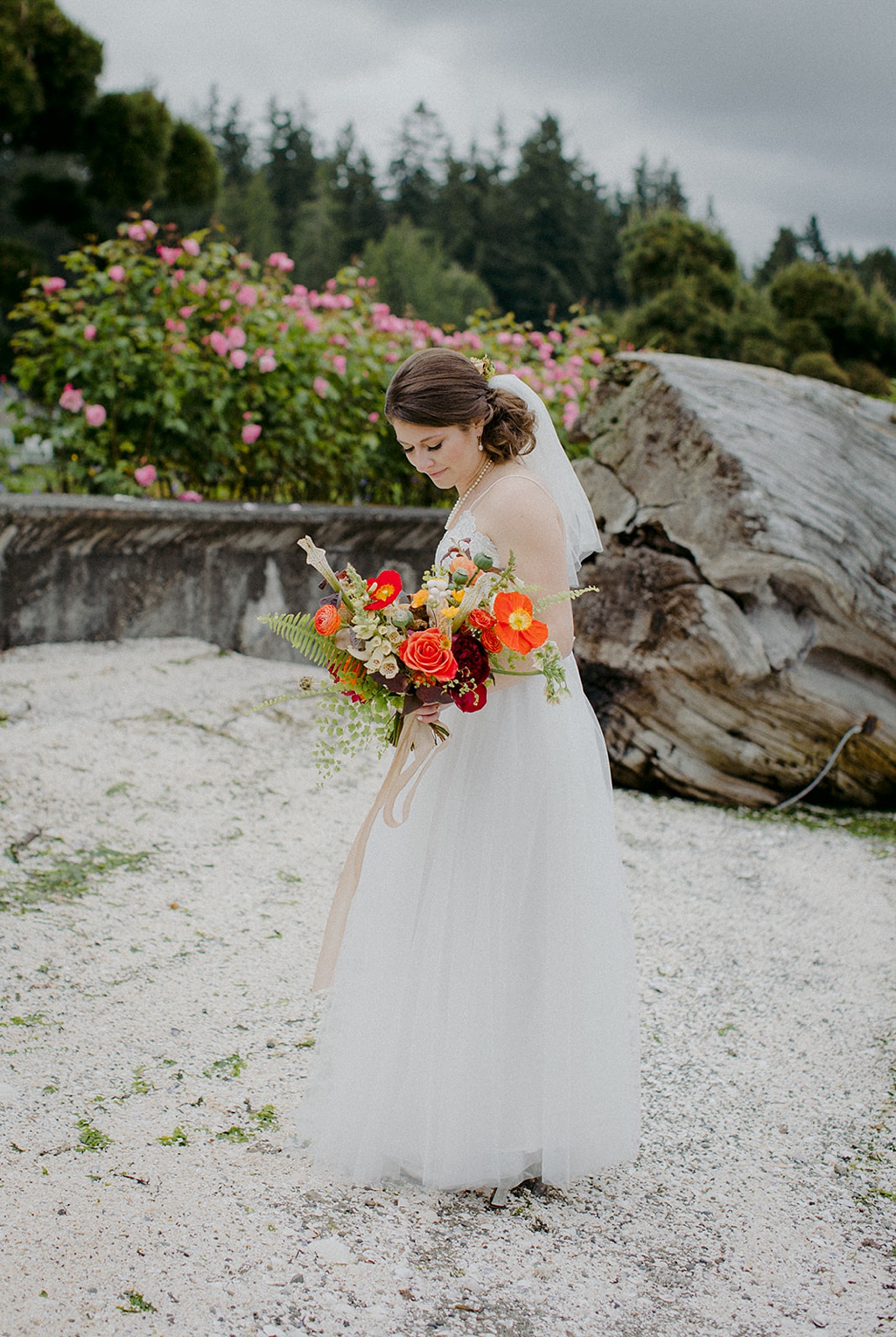 The bride holding her bouquet at Kiana Lodge