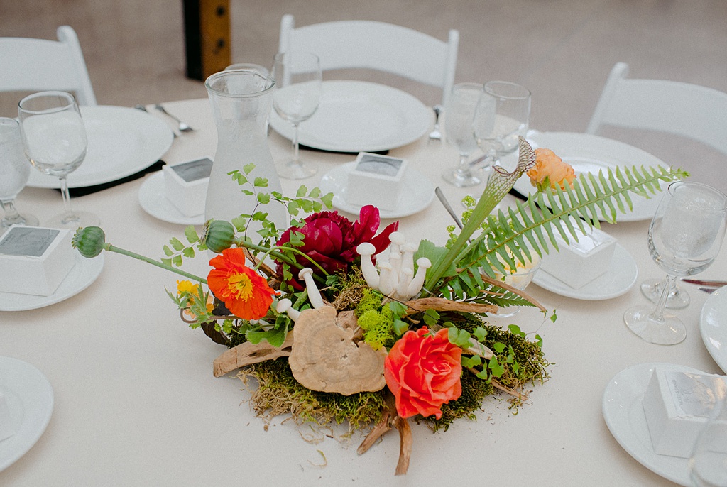A wedding centerpiece with mushrooms and roots