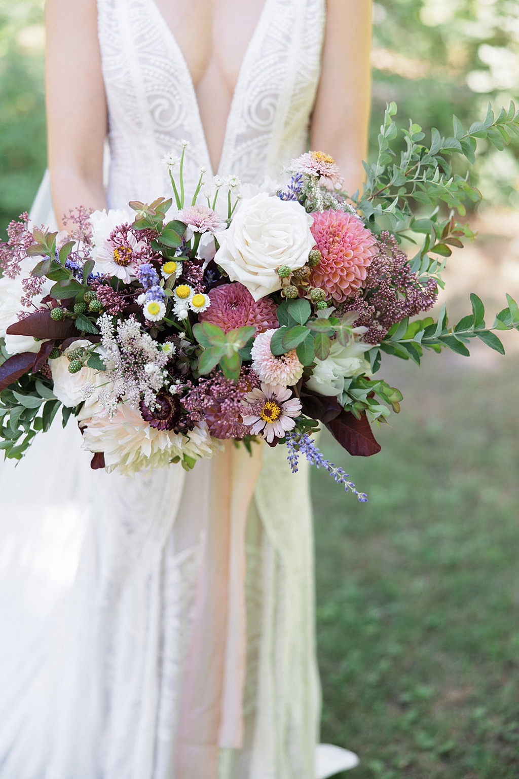 The bridal bouquet at this Tierra Retreat Center wedding uses seasonally inspired flowers in blush, pink, and purple tones