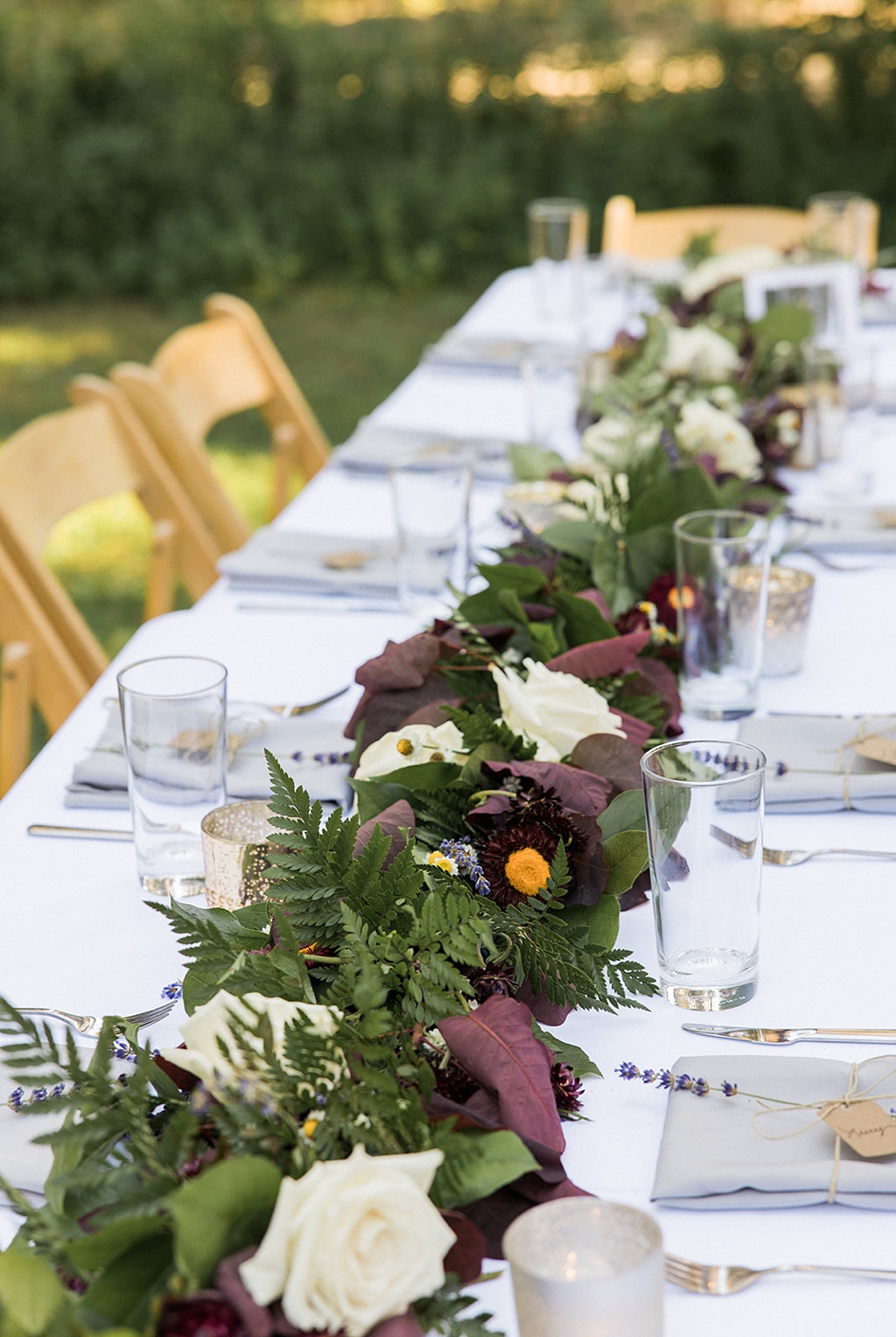 Wedding reception at Tierra Retreat Center with floral runners down long tables