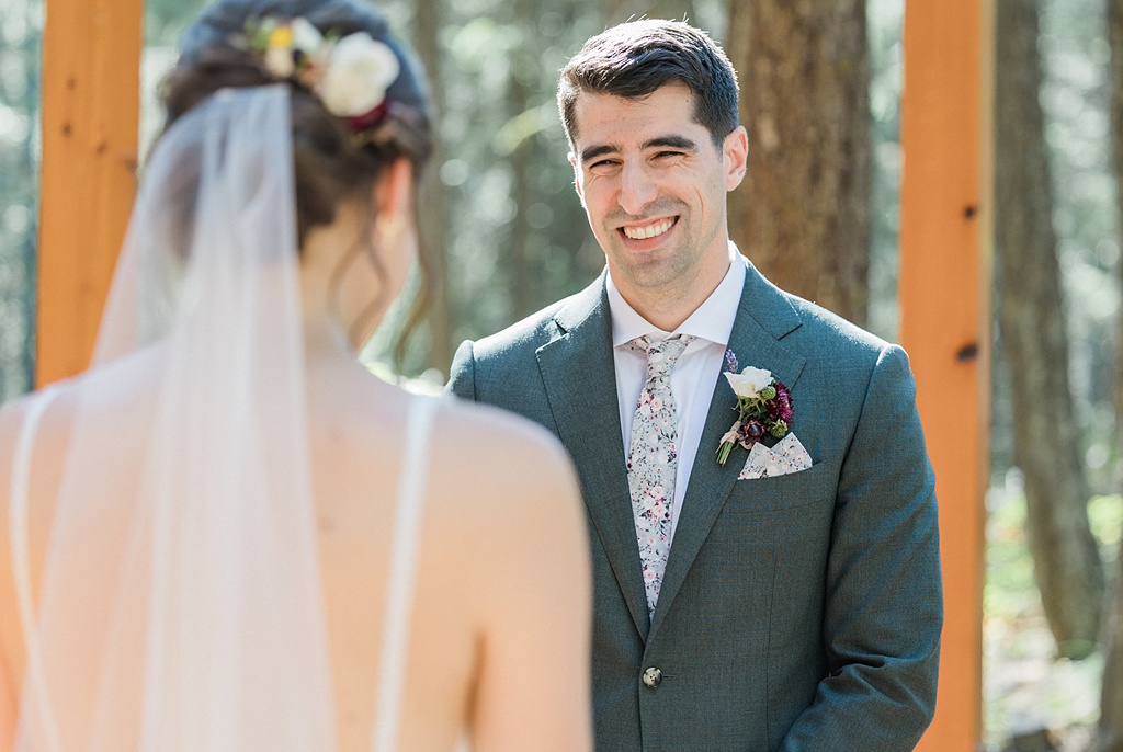 The groom looks on to his bride lovingly during the wedding ceremony at Tierra Retreat Center