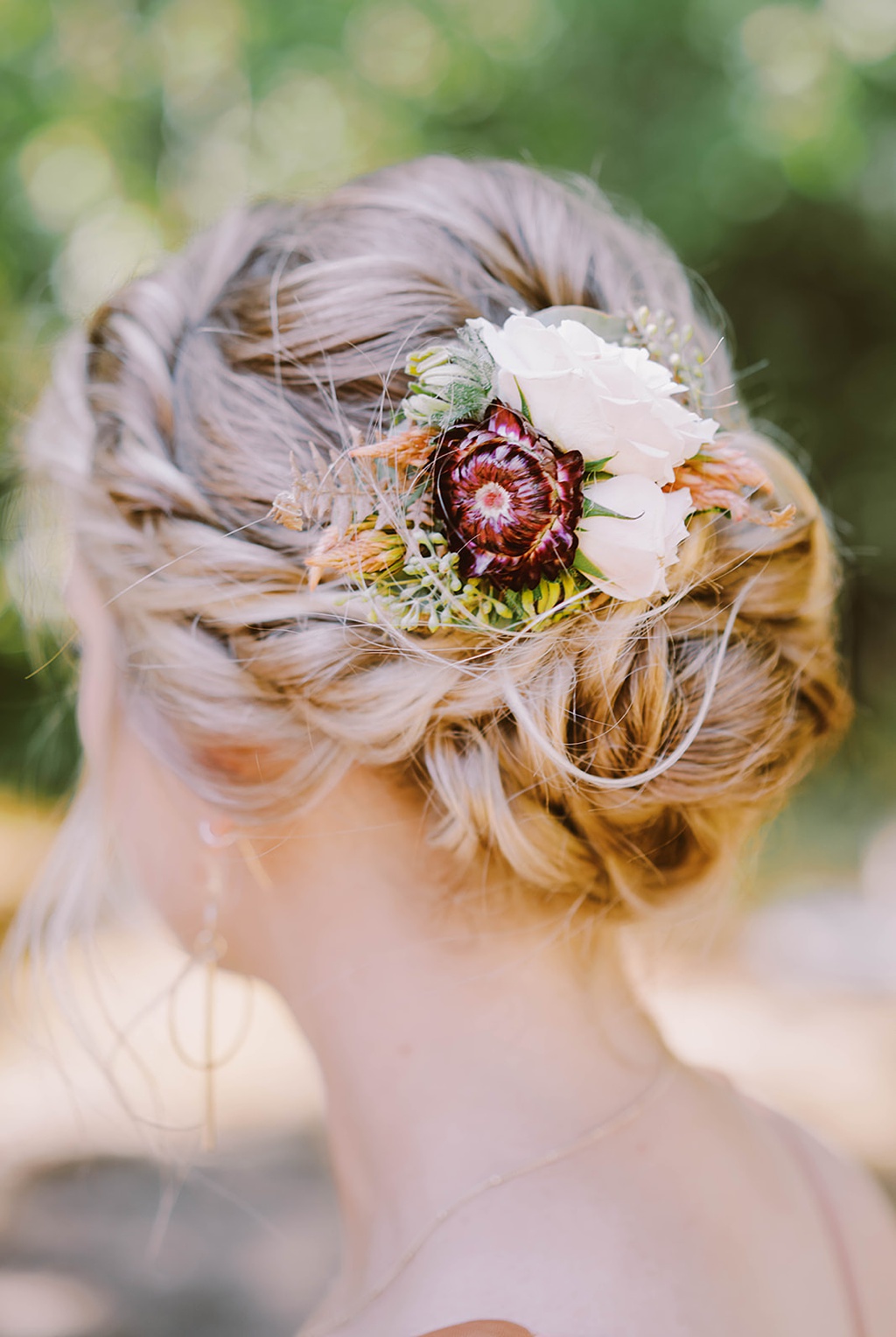 A bridesmaid with hair florals